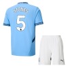 Maillot de Supporter Manchester City Stones 5 Domicile 2024-25 Pour Enfant